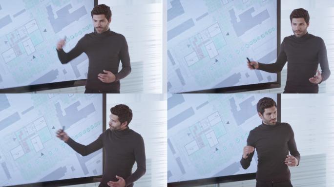 男建筑师解释会议室大屏幕上的计划细节