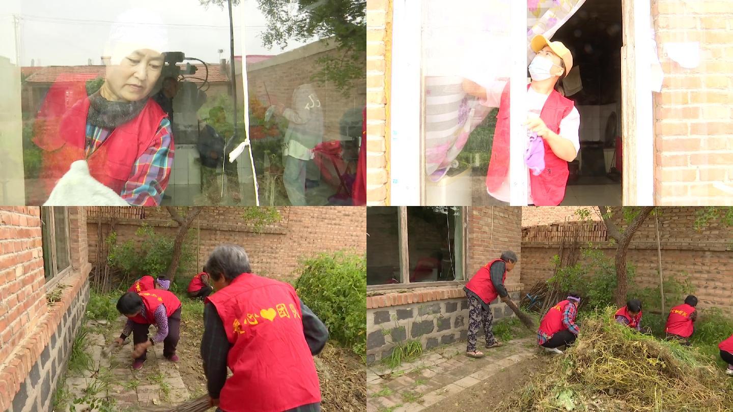 村里的爱心团队志愿者帮助村民搞卫生擦玻璃