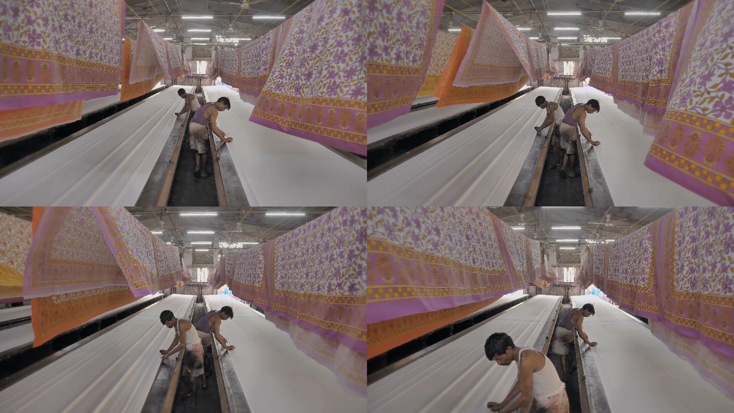 在纺织印染厂内部工作的工人的移动镜头