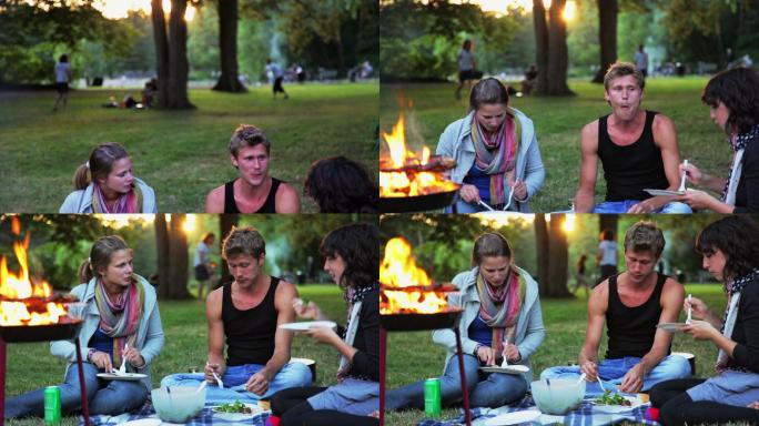 年轻人在公园里烧烤。