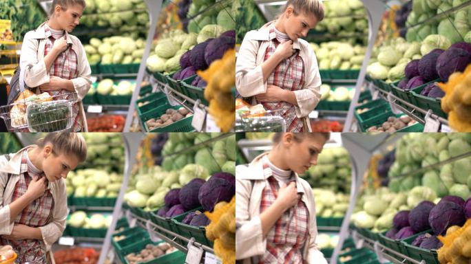 在超市买水果的女人。