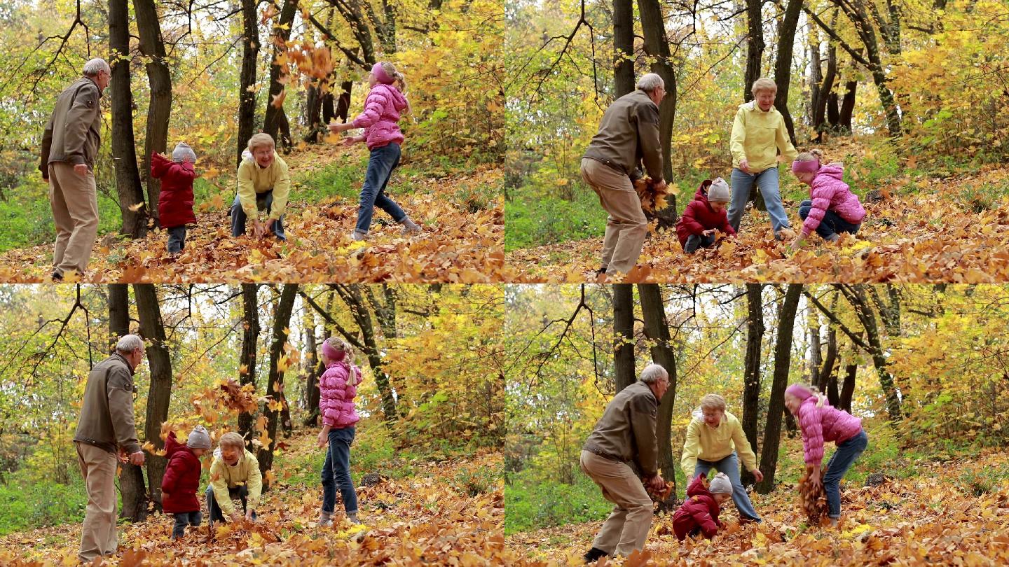 爷爷奶奶和孩子们在秋季公园玩得很开心