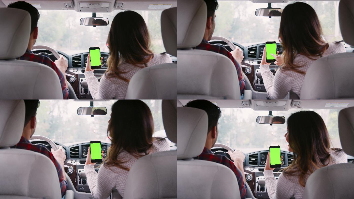 女性乘客在乘车途中使用智能手机上的GPS