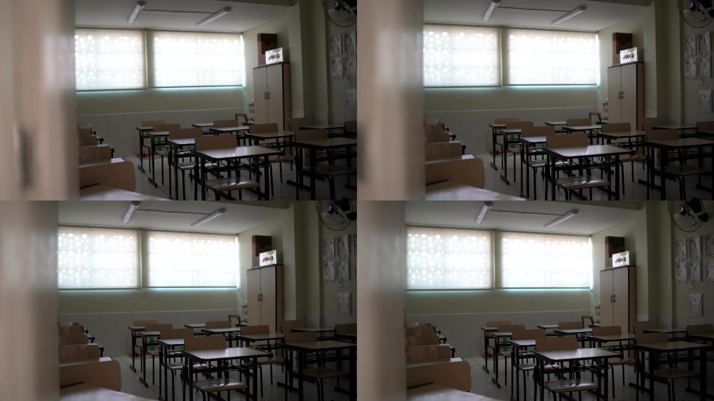 空课桌放在空教室里——学校主题