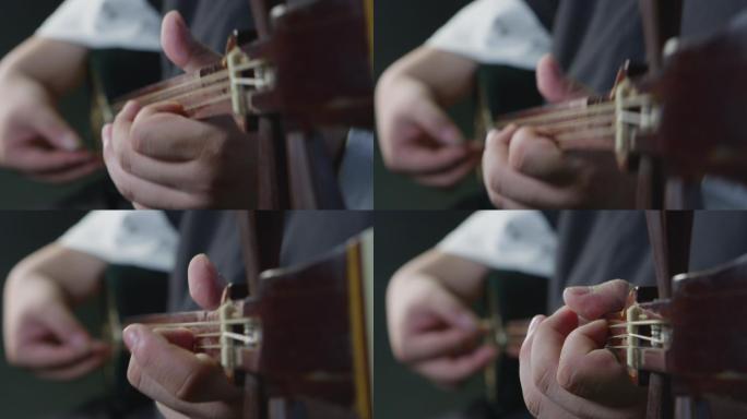 男人演奏三弦的手的特写