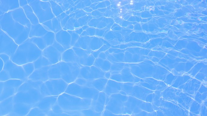 蓝色游泳池水面背景。