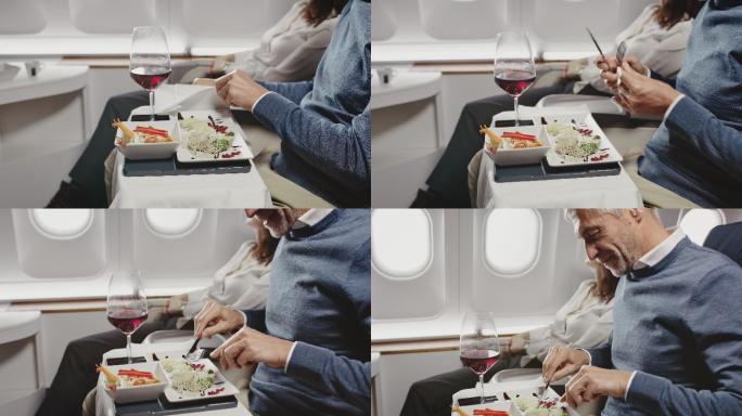 在私人飞机上吃午餐的商人
