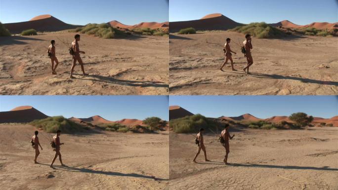 在纳米布沙漠行走的两个人
