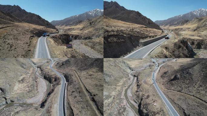 甘肃扁都口公路雪山草原车辆