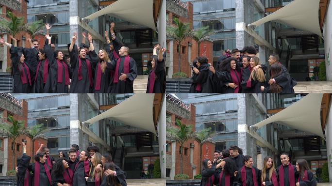 大学毕业生一边庆祝一边把毕业帽抛向空中