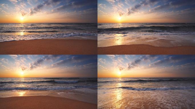 海浪冲刷着沙子。夏日夕阳黄昏航拍海浪声