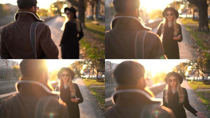 秋日阳光明媚，一对年轻夫妇在散步