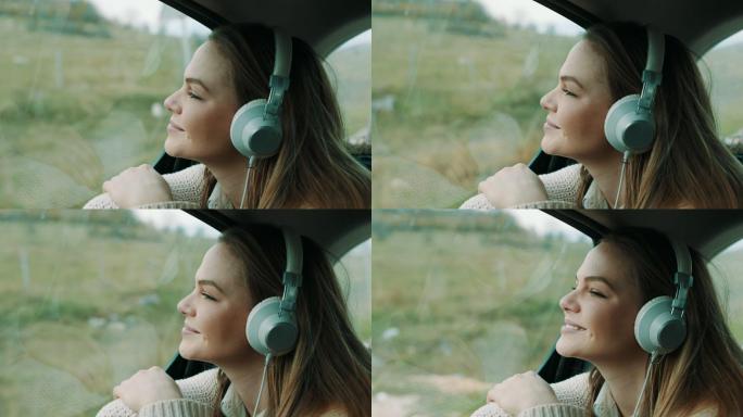 坐在汽车后座听音乐的女孩