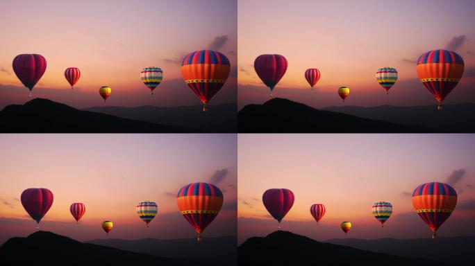 夏日日落时彩色热气球飞过