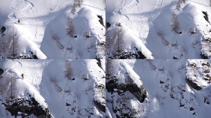 自由式滑雪者从悬崖上跳入雪崩