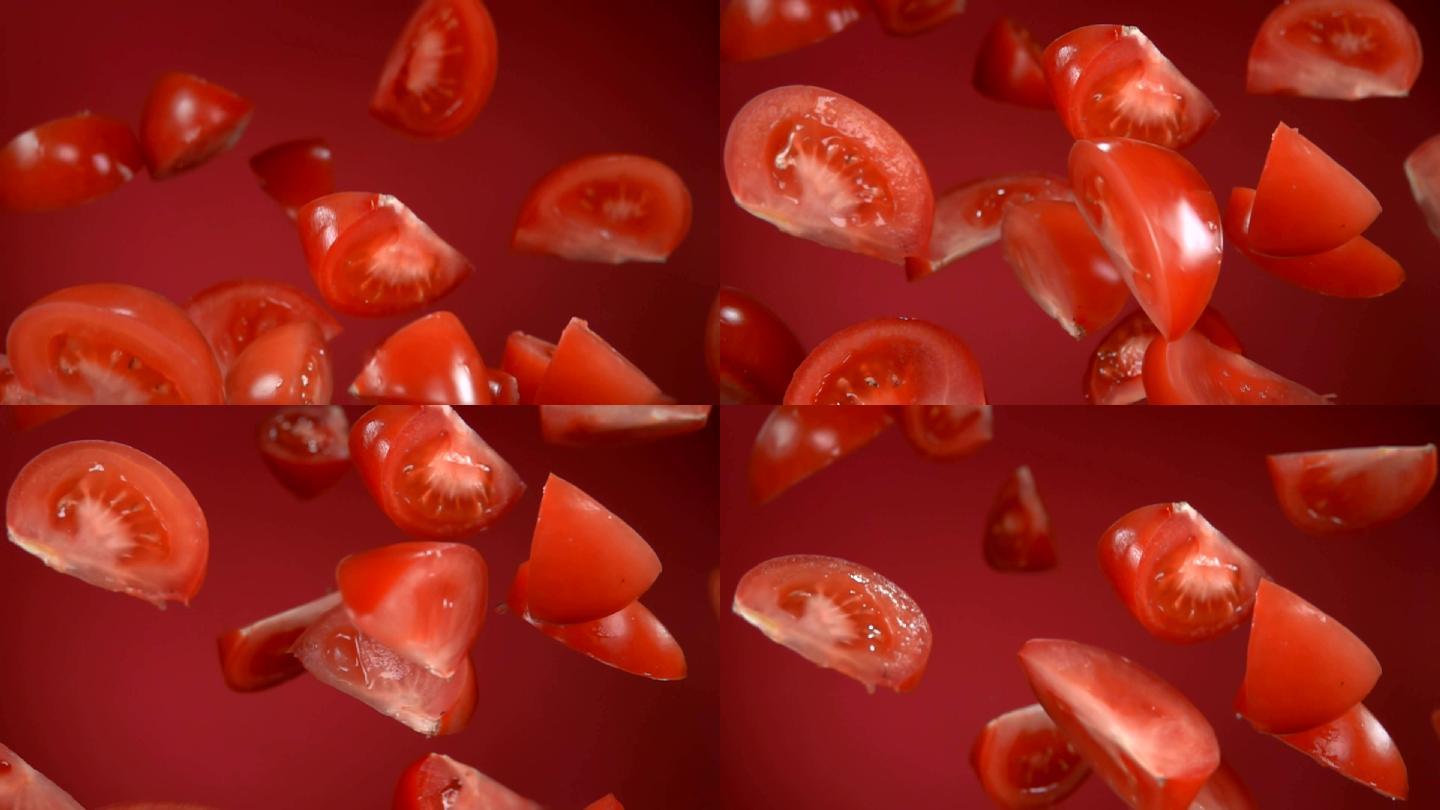 红色成熟多汁的番茄片在红色背景上飞扬