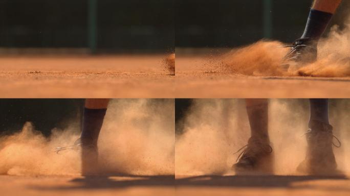 网球运动员的腿在地上滑行，超慢动作