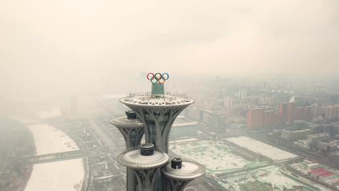 4k航拍北京奥林匹克公园鸟巢飞雪横向2