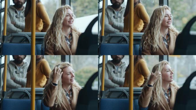 在公共汽车上微笑的年轻女孩