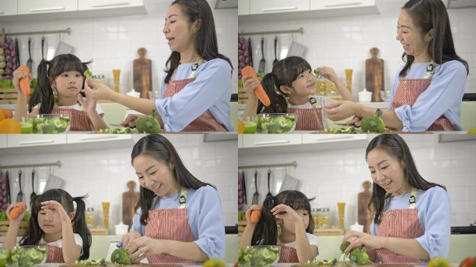 母亲和女儿在厨房里准备蔬菜