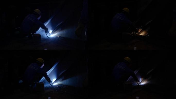 工人黑夜里焊接钢材