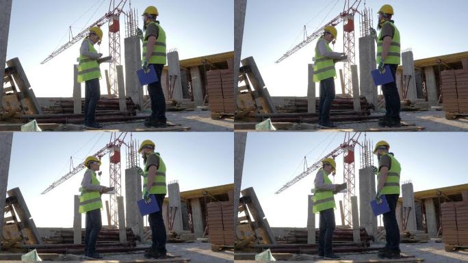 建筑师在建筑现场检查建筑进度。