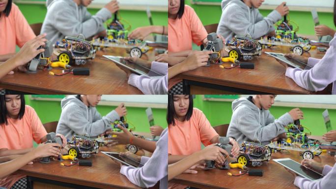 中学科技课堂：老师向孩子们讲解如何操作机器人程序