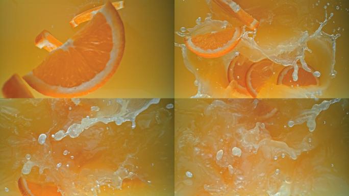 橙子片掉入果汁的镜头