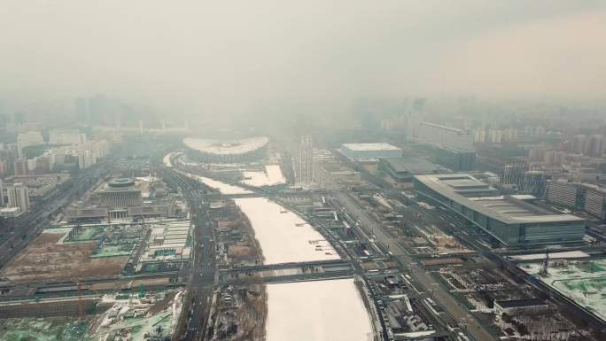 4k航拍北京奥林匹克公园鸟巢飞雪横向1