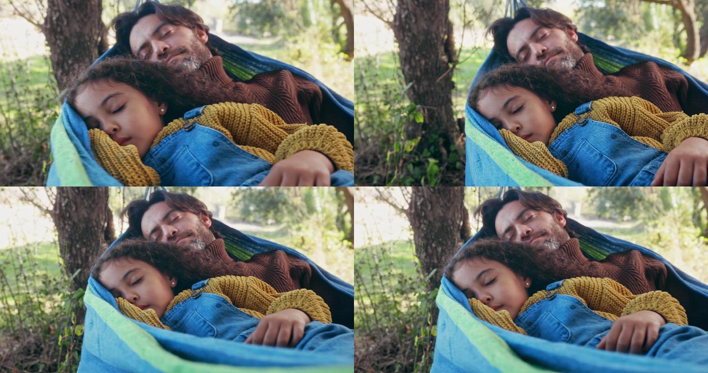 父女俩睡在树林里的吊床上