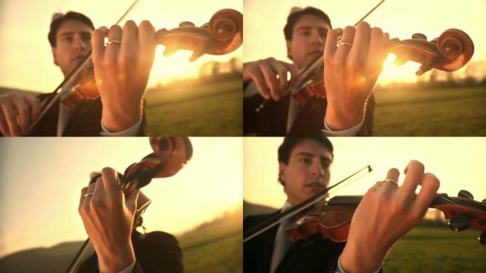 年轻人站在户外草地上激情地拉小提琴
