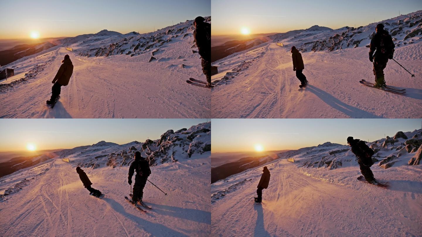 日落斜坡滑雪者户外运动冒险极限运动