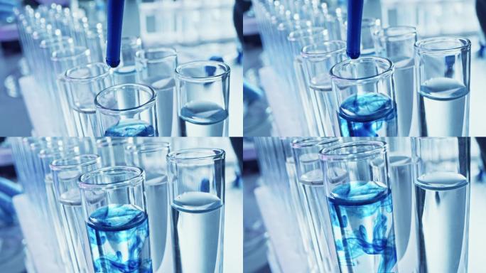 药剂学实验室：用移液管将蓝色液体滴入试管