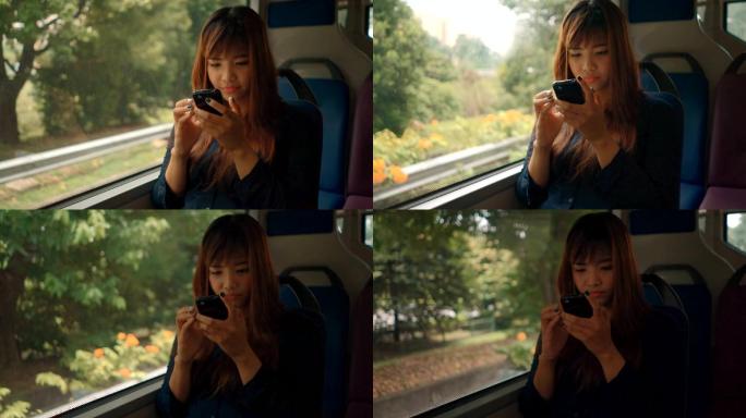 在公交车上使用智能手机的女性特写镜头