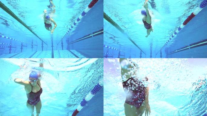 年轻女性自由泳奥运会潜水练习花样游泳
