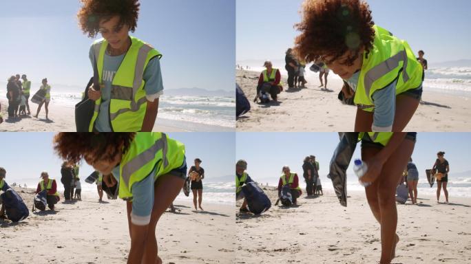 女性志愿者在阳光明媚的日子清洁海滩4k