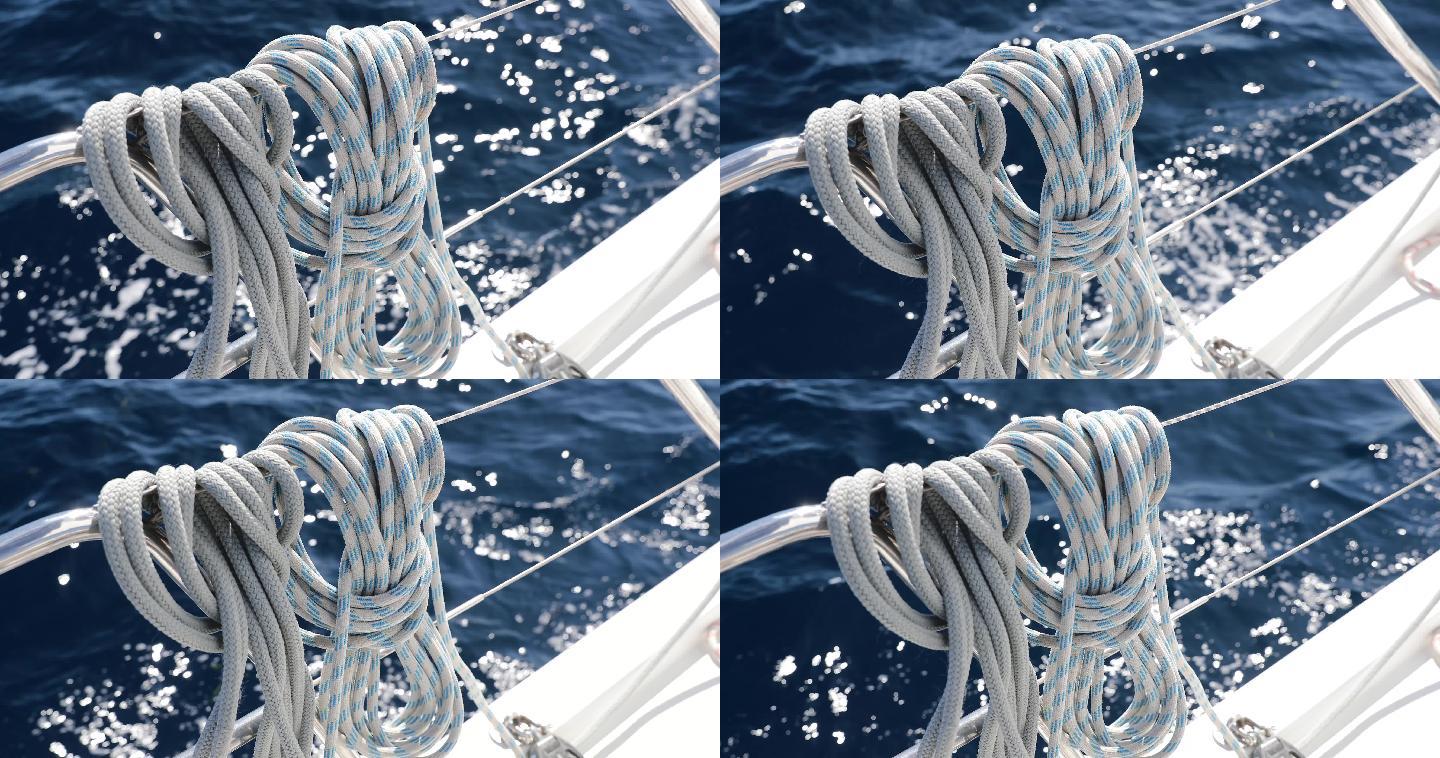 晴朗天气下的帆船缆绳、桅杆上的滑轮和缆绳