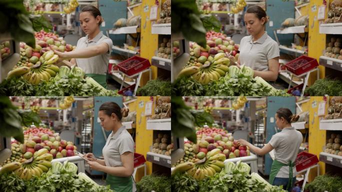 女售货员在市场摊位上用剪贴板清点蔬菜