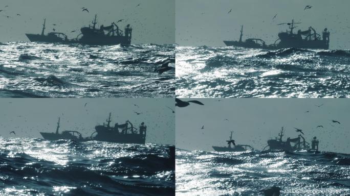在波涛汹涌的大海中捕鱼的渔船
