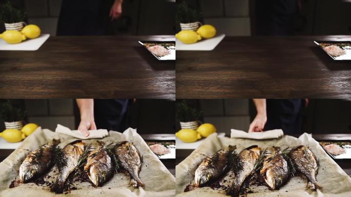 把一张烤着新鲜烤鱼的烤盘放在桌上。