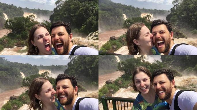 在伊瓜苏瀑布时，一对情侣正在自拍