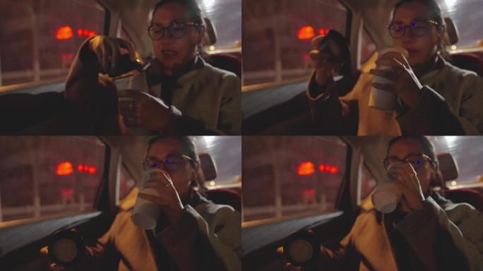 女白领在车里喝咖啡