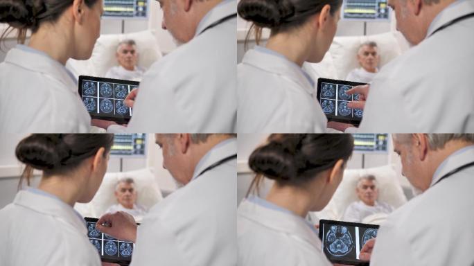 两位医生检查病人的X光片