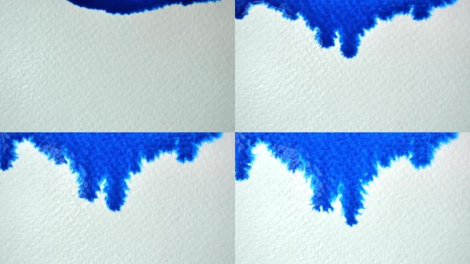 蓝色水彩在纸上蔓延