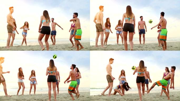 在沙滩上玩排球的一群人