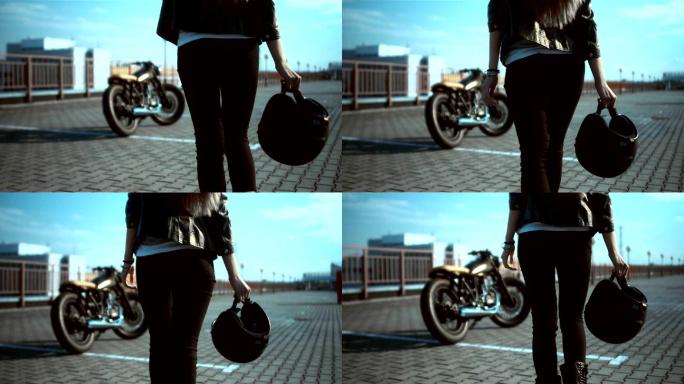 女性摩托车手女摩托车手手拿头盔摩托车视频