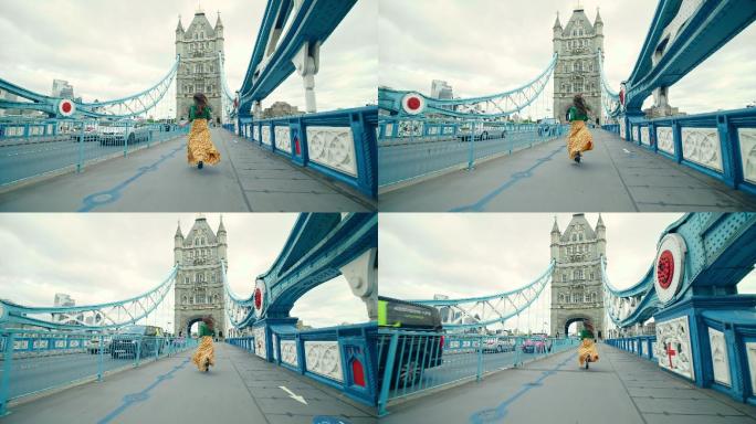 英国伦敦城，一个穿着衣服的美丽女孩在塔桥上奔跑。