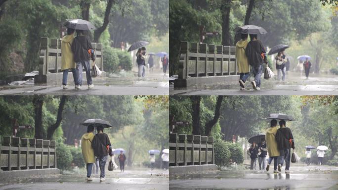 闺蜜雨中挽手散步