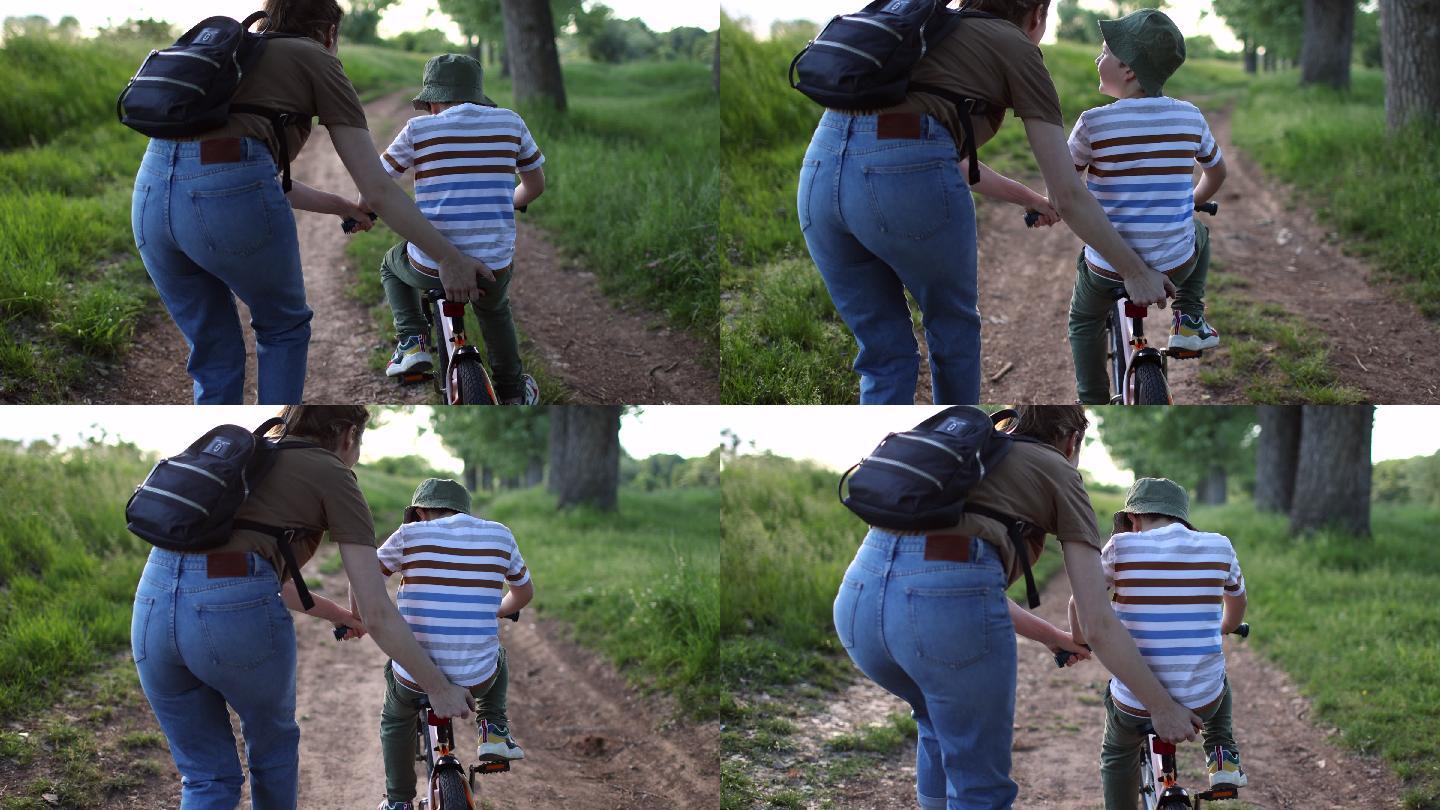 学习骑自行车身影背影骑车单车练习妈妈孩子