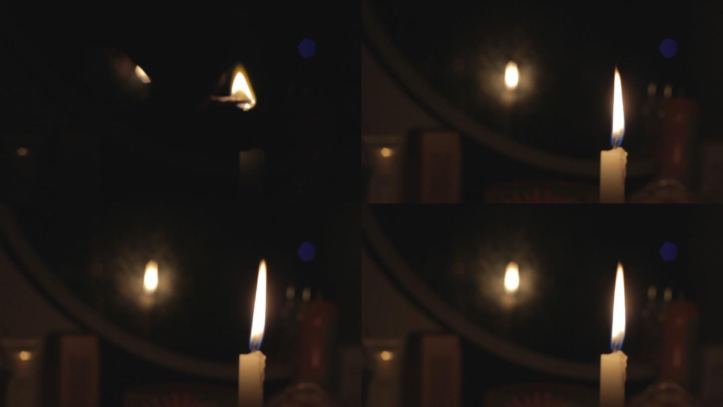 黑暗中点燃白色蜡烛写意镜头
